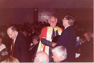 Mike Brady and Peter Cochrane greet each other